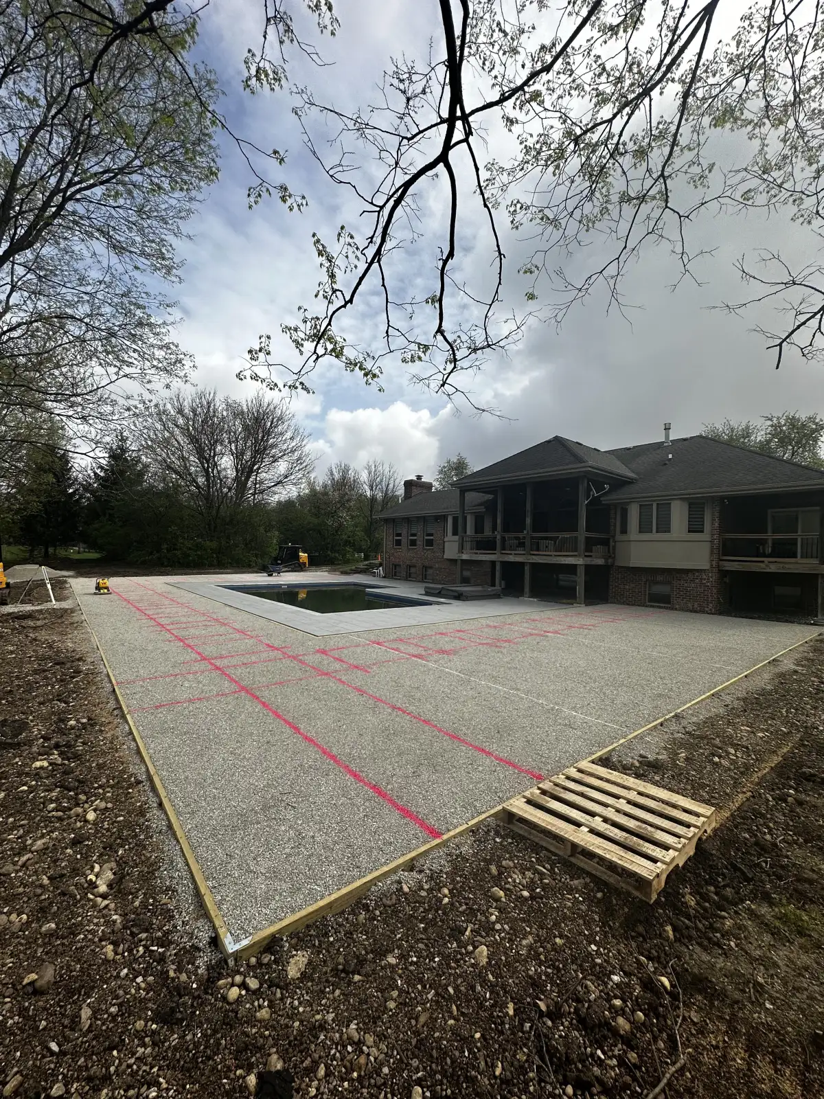 Complete yard renovation with turf, retaining wall, and plantings